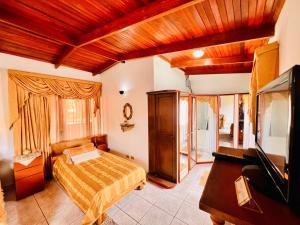 En eller flere senge i et værelse på Casa para grupos grandes 28 huéspedes