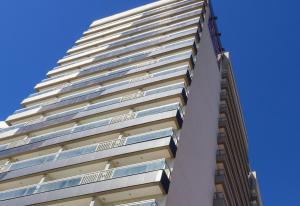 a tall building with balconies on the side of it at Promenade Fusion Itaguaí in Itaguaí