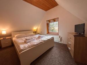 En eller flere senge i et værelse på Domek Górski Czarna Góra przy wyciągach