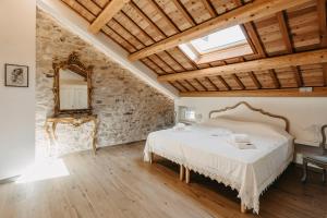 Postel nebo postele na pokoji v ubytování Locazione turistica tra le Dolomiti Bellunesi Corte Maccarini