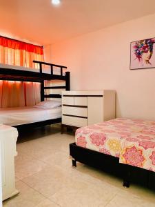 Ένα ή περισσότερα κρεβάτια σε δωμάτιο στο Rodadero Ocean View Apartment +13 φωτογραφίες