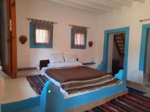 Ένα ή περισσότερα κρεβάτια σε δωμάτιο στο Sand Gate Camp Hotel