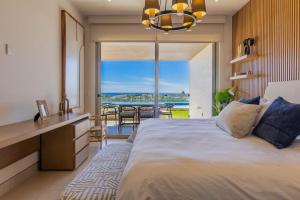 En eller flere senge i et værelse på Vista Del Arco - Vista Vela Sunset + 44 billeder