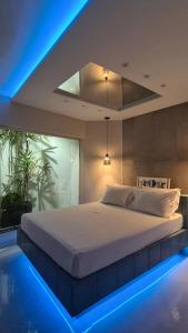 En eller flere senge i et værelse på Stillus Private Motel