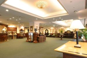 a large lobby with a waiting area with furniture at Hotel Grand Terrace Sendai Kokubun-cho in Sendai