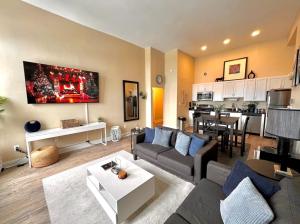 a living room with a couch and a table at The Nest At Twelve in Detroit