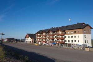 a street with a row of buildings on the side of a road at Ylläs Chalets 7305 in Ylläs