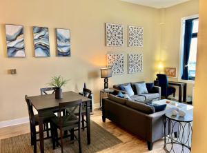 a living room with a couch and a table at The Nest At Twelve in Detroit +8 photos