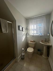 a bathroom with a toilet and a sink at Beauclaires Bed & Breakfast in Cape May +76 photos