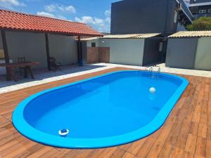 a large blue swimming pool on a wooden deck at Hotel Monte Carlo - Cáceres in Cáceres +19 photos