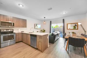 a kitchen and living room with a table and a dining room at Spacious Townhouse W Free Parking in Miami