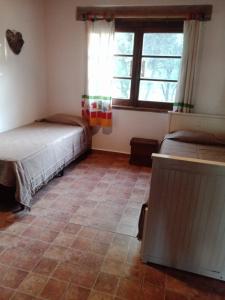 En eller flere senge i et værelse på Casa de campo La Chunia