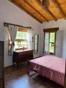 En eller flere senge i et værelse på Casa de campo La Chunia