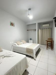 Postel nebo postele na pokoji v ubytování Hotel Monte Carlo - Cáceres