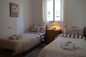 En eller flere senge i et værelse på Apartment with balcony, Cabo Roig, La Rotonda