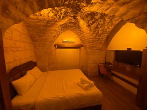 En eller flere senge i et værelse på Ayataç Konak Otel