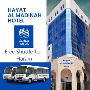 a white bus parked in front of a building at Hayat Al madinah Hotel فندق حياة المدينة in Al Madinah