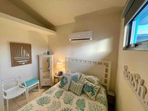 En eller flere senge i et værelse på Atlantic Wave Villa