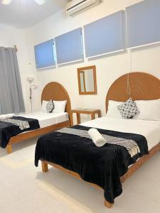 Postel nebo postele na pokoji v ubytování Mittoz House with beach access in Holbox downtown