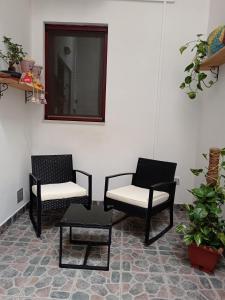a room with two chairs and a table and a mirror at B&B Casa dolce casa in Cutrofiano +30 photos