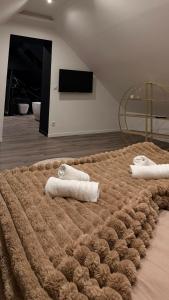 En eller flere senge i et værelse på T4 Luxe