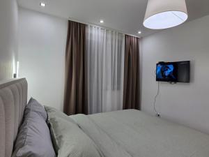 TV a/nebo společenská místnost v ubytování Masa + 8 fotografií