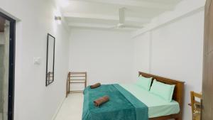 Ένα ή περισσότερα κρεβάτια σε δωμάτιο στο My Transit Stay Hotel