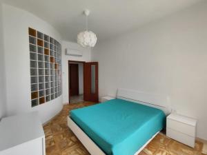 En eller flere senge i et værelse på Appartamento vista mare vicino al mare e al centro