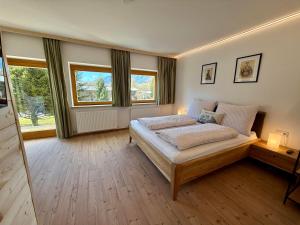 Postel nebo postele na pokoji v ubytování Bergnest Appartements