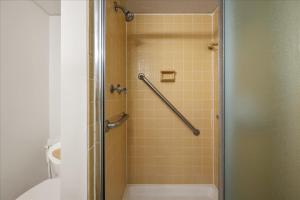 a bathroom with a shower with a glass door at 2 Bedroom Ocean Block Condo, Steps to the Beach! in Ocean City +28 photos
