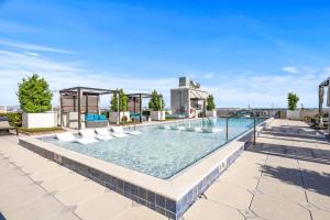 an image of a swimming pool on top of a building at Elegant 1BR Walkable to Dining, Pool + Gym in Tampa