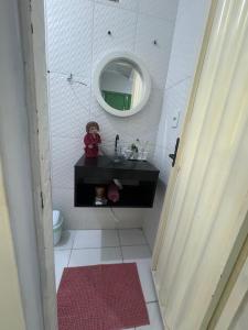 a bathroom with a sink and a mirror at PNZ Loft 2 in Petrolina +12 photos