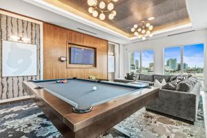 a living room with a pool table at Chic Channelside Getaway in DT | Close to DT! in Tampa