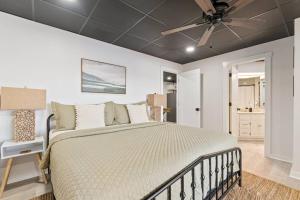 a bedroom with a bed and a ceiling fan at Billion Dollar Views in Winchester