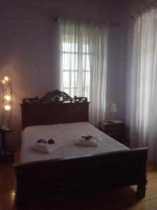 En eller flere senge i et værelse på Σπίτι στο Χωριό - Les campagnards