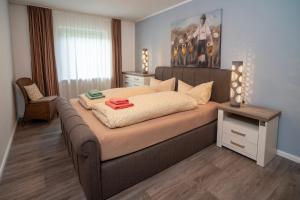 En eller flere senge i et værelse på Ferienhaus AlpenVilla