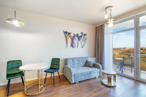 Posezení v ubytování Apartament Emerald Gold przy plaży - Darmowy Parking + 5 fotografií