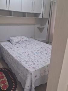 a small bed in a room with a bed sidx sidx sidx at Casa Torres in Torres