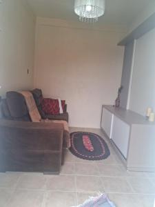 a living room with a couch and a rug at Casa Torres in Torres +1 photo