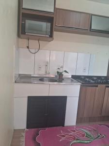 a small kitchen with a sink and a stove at Casa Torres in Torres