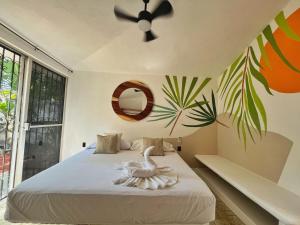 En eller flere senge i et værelse på Casa Amanecer