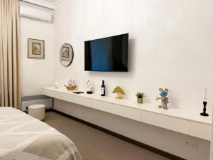 Μια τηλεόραση ή/και κέντρο ψυχαγωγίας στο Wine Garden Hotel Comrat