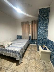 En eller flere senge i et værelse på Casa na praia de Capão da Canoa