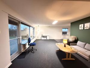 Et opholdsområde på Cozy home for a family for stay