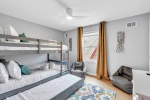 a bedroom with two bunk beds and a window at 127 Fremont in Seaside Heights