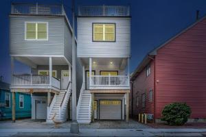 a house with stairs in front of two houses at 127 Fremont in Seaside Heights