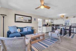 a living room with a blue couch and a table at 209 4th Ave in Seaside Heights