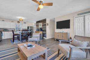 a living room with a couch and a table at 209 4th Ave in Seaside Heights