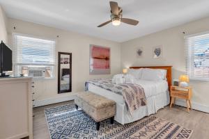 a bedroom with a bed and a ceiling fan at 209 4th Ave in Seaside Heights