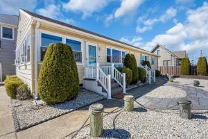 a house with a porch and bushes at 209 4th Ave in Seaside Heights